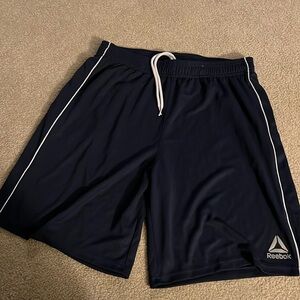 Never worn men’s navy blue Reebok athletic shorts size medium